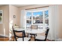 Bright dining area with bay window and seating for four at 5123 Bryant St, Denver, CO 80221