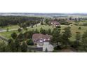 Scenic view of a two story home surrounded by trees and a vast landscape at 7641 Kelty Trl, Franktown, CO 80116