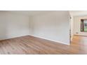 Bright living room with hardwood floors and neutral walls, ready for personalization and comfort at 6587 S Clarkson St, Centennial, CO 80121