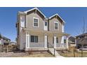 Attractive two-story home showcasing a cozy front porch and a clean, modern exterior design at 18049 E 106Th Ave, Commerce City, CO 80022