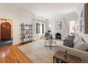 Spacious living room with hardwood floors, fireplace, and bright natural light provides a cozy, inviting space at 1470 Utica St, Denver, CO 80204