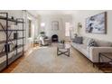 Bright living room with fireplace, natural light, and a neutral color palette creating a relaxing atmosphere at 1470 Utica St, Denver, CO 80204