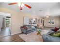 Open-concept living room features hardwood floors and seamless flow into other living spaces at 4570 S Kalispell Way, Aurora, CO 80015
