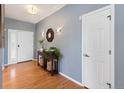 Welcoming entryway with hardwood floors and stylish decor leading into the home at 4515 W 107Th Cir, Westminster, CO 80031