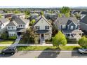 Well-situated home showcasing charming architecture and a meticulously maintained front yard at 10822 E 28Th Pl, Denver, CO 80238