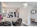 Kitchen featuring gray cabinets, granite countertops, stainless steel appliances, and breakfast bar seating at 2740 W 86Th Ave # 190, Westminster, CO 80031
