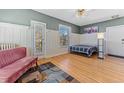 Relaxing bedroom with hardwood floors, a doorway to the outside, and soothing natural light at 1356 N Pearl St # 202, Denver, CO 80203