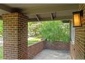 Relaxing front porch with brick columns, offering a peaceful outdoor space at 2271 Holly St, Denver, CO 80207