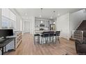 Modern kitchen featuring a center island with bar seating and stainless steel appliances at 9590 Sedalia St, Commerce City, CO 80022