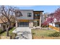 Modern two-story home showcasing contemporary design, complemented by a well-maintained front yard at 3485 S Clermont St, Denver, CO 80222