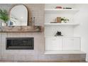 Close-up of a fireplace, complemented by a decorative mirror, offering a cozy and inviting ambiance at 3485 S Clermont St, Denver, CO 80222