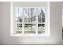 Bright room with a large window view of the surrounding neighborhood and green outdoor space at 5977 S Rock Creek Dr, Castle Rock, CO 80109