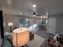 Cozy living area with open floor plan, modern lighting, and neutral color scheme at 1250 S Monaco Pkwy # 17, Denver, CO 80224