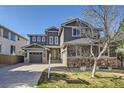 Attractive two-story home featuring a well-kept lawn and multi-car garage at 10774 Chadsworth Ln, Highlands Ranch, CO 80126