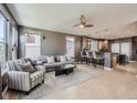 Open-concept living space with neutral colors and sleek flooring at 10774 Chadsworth Ln, Highlands Ranch, CO 80126