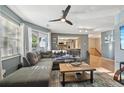 Bright living room with an open layout to the kitchen and staircase at 12655 E Pacific Cir # C, Aurora, CO 80014