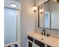Bathroom featuring pendant lights, and a modern sink and faucet at 384 S Ironton St # 208, Aurora, CO 80012