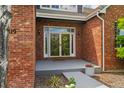 Inviting entryway with double glass doors and manicured landscaping at 7119 S Riviera St, Aurora, CO 80016