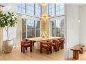 Sun-filled dining area features large windows and seating for eight at 1001 S Adams St, Denver, CO 80209