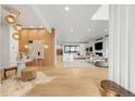 Bright, open-concept living room featuring wood floors and stylish modern decor at 1001 S Adams St, Denver, CO 80209