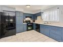 Well-lit kitchen with stainless steel appliances and ample counter space at 5360 Monaco St, Commerce City, CO 80022