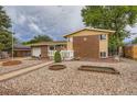Inviting home with a neatly landscaped front yard and attached garage at 6072 Pierson Ct, Arvada, CO 80004