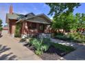 Beautiful brick home with lush greenery and a well-maintained yard at 3237 N Josephine St, Denver, CO 80205