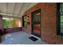 Inviting front porch with brick accents and an elegant security door at 3237 N Josephine St, Denver, CO 80205