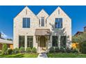 Stunning stone home featuring a copper awning and beautifully framed windows at 2365 S Clayton St, Denver, CO 80210