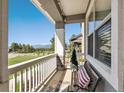 Inviting porch with relaxing bench seating and scenic neighborhood views at 763 Sage Forest Ln, Monument, CO 80132
