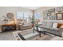 Cozy living room featuring neutral tones and filled with natural light at 763 Sage Forest Ln, Monument, CO 80132
