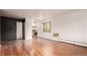 Inviting living room with hardwood floors and easy kitchen access at 200 N Sherman St # 7, Denver, CO 80203