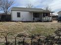 View of the home and backyard, showing the backyard and exterior features of the property at 7080 Cherry St, Commerce City, CO 80022