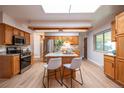 Bright kitchen features a center island, stainless steel appliances, and granite countertops at 1849 S Van Gordon Ct, Lakewood, CO 80228