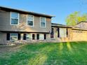 Two-story home with brick accents, a well-kept lawn, and a welcoming entrance at 2118 S Mobile Way, Aurora, CO 80013