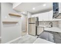 Modern kitchen with white cabinets and stainless steel appliances at 2707 Valmont Rd # 106B, Boulder, CO 80304