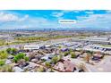 Aerial view of property with Downtown Denver in the background, showcasing its prime location and neighborhood at 5470 Krameria St, Commerce City, CO 80022