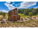 Montaine Vista community sign with landscaping and blue skies at 268 Simmental Loop, Castle Rock, CO 80104