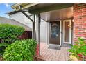 Inviting front porch with brick accents, providing a warm welcome to the home at 6338 S Oneida Ct, Centennial, CO 80111