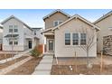 Charming exterior featuring neutral brick, well-manicured landscaping, and inviting entrance at 23820 E 34Th Ave, Aurora, CO 80019