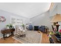 Bright living room featuring high ceilings, large windows, and comfortable seating area at 6040 Taft Ct, Arvada, CO 80004