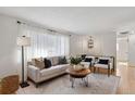 Light-filled living room with comfortable seating and large windows at 9647 Pelon Dr, Northglenn, CO 80260