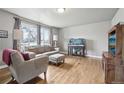 Inviting living room with hardwood floors and large windows allowing ample natural light at 55 Emerald St, Broomfield, CO 80020