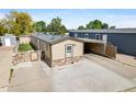 Charming single story home with a paved drive, carport and stone accents at 8426 Cook Way, Denver, CO 80229
