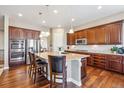 Spacious kitchen with a large island, stainless steel appliances, and granite countertops at 6711 S Catawba Way, Aurora, CO 80016