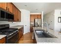 Well-equipped kitchen with granite counters, stainless appliances, and ample storage space at 3567 E 140Th Dr, Thornton, CO 80602
