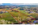 Aerial view of property outlined with a red border; highlights expansive acreage and surrounding community at 5800 W Bowles Ave, Littleton, CO 80123