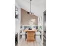 A dining area with statement wood accent wall, modern decor, and bright, natural light at 4269 Carter Trl, Boulder, CO 80301