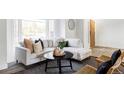 Bright and airy living room featuring stylish furniture and a large window at 4269 Carter Trl, Boulder, CO 80301