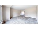 Bright living room featuring neutral paint, new carpet, and a large window at 3387 S Pitkin Way, Aurora, CO 80013